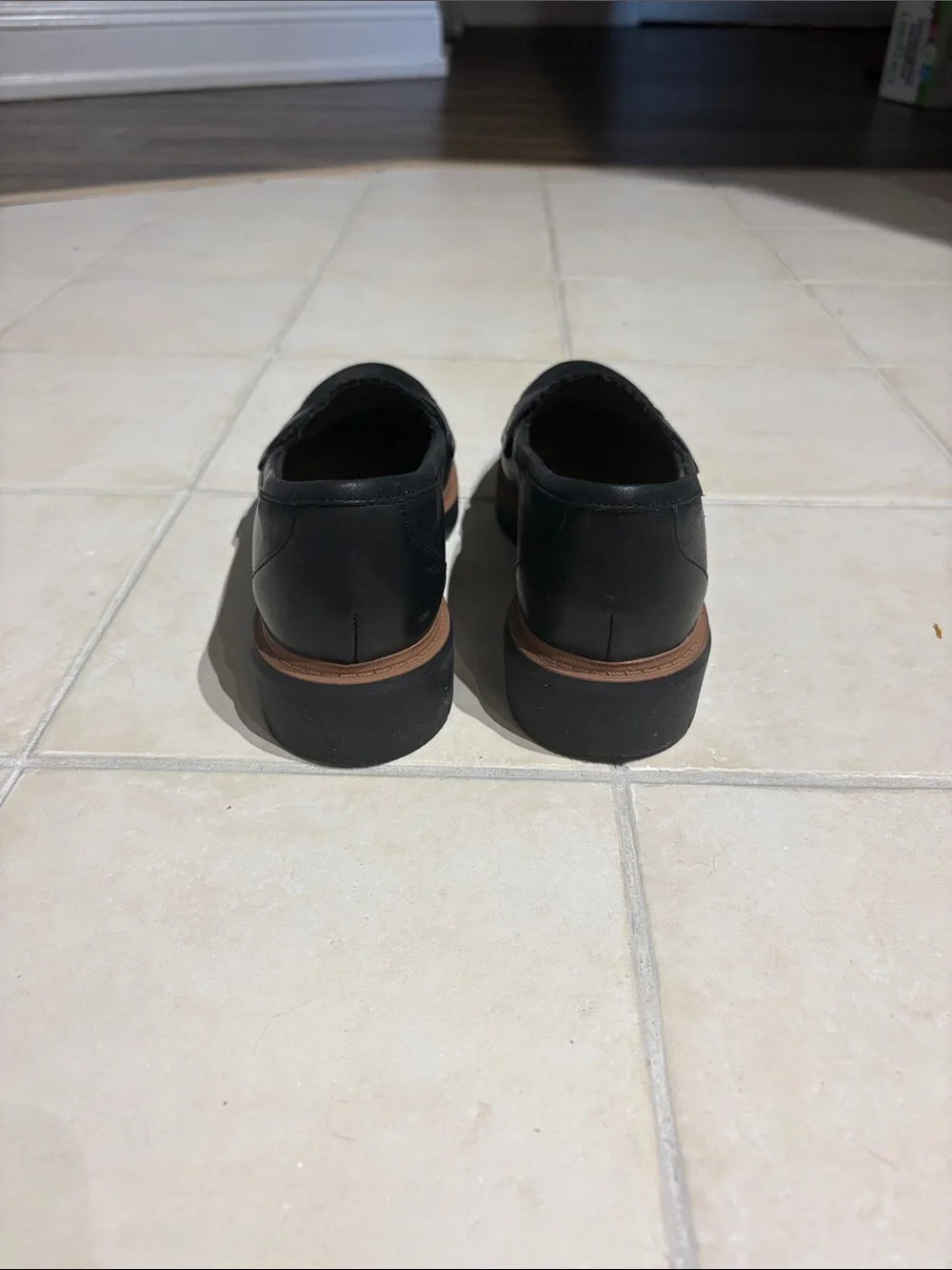 Clarks Black Leather Tassel-Style Slip-On Loafers with Brown Sole Accent